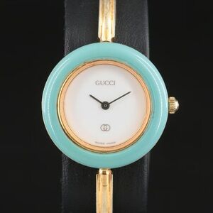 Gucci 1100L Quartz Green Bezel and Gold-Plated Bangle Watch